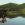 A woman is seated in a calm spot on the Sim River, part of the Volga watershed in 1910